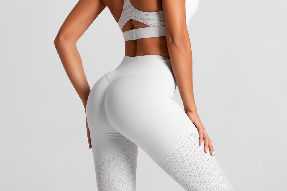 Close up of woman's full, round butt in workout wear after a BBL in Salt Lake City, UT